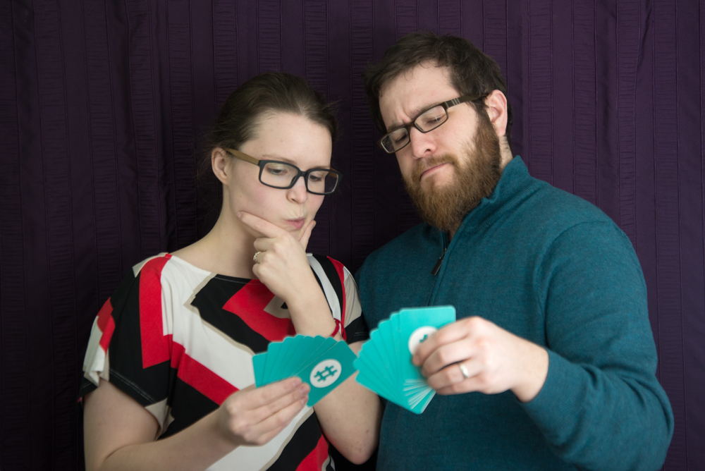 Danny and Alyse holding Storytags cards.